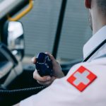 a paramedic holding a radio